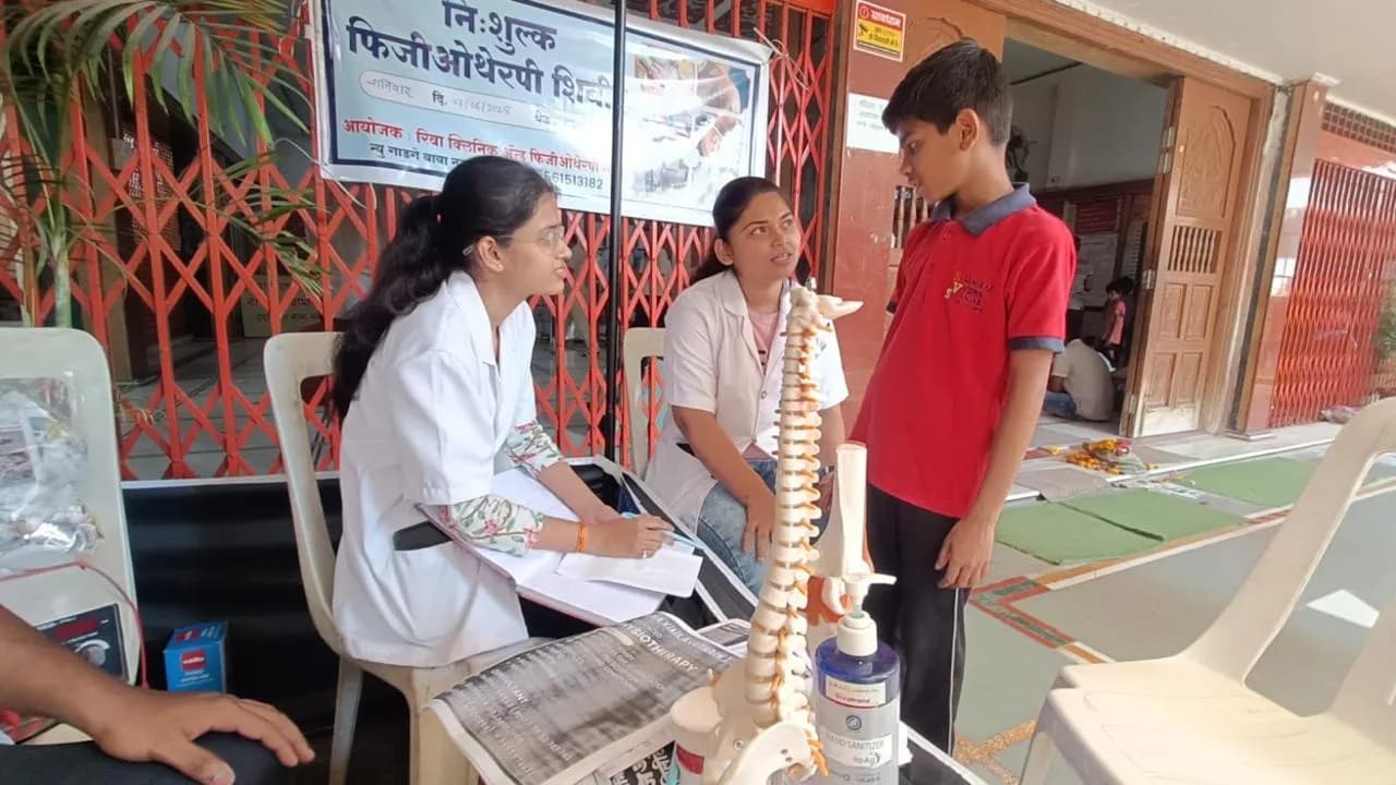 Free physiotherapy camp: therapists assessing a young patient
